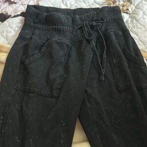 Black Livi short joggers with white specks on them